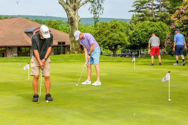 Golfers participating in chipping contest