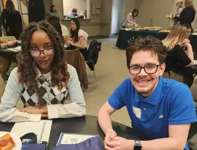 Two students smiling at UHart's Finale Innovation Challenge