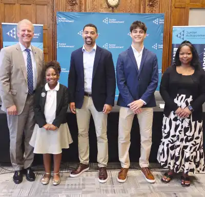 Panelists stand proudly at JA's National Financial Awareness Day Panel